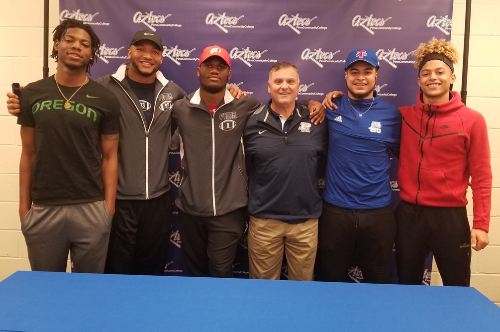 Five of Pima's football players signed their letters of intent to NCAA Division I schools on Wednesday (left to right): Haki Woods (Oregon), Keith Brigham (Memphis), Bryant Pirtle Jr. (Utah), DeMarco Corbin (Tennessee State) and Aaron Maddox (Colorado). Photo by Raymond Suarez