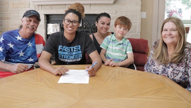 Sophomore forward Aubre Fortner signed her letter of intent to play at Fort Lewis College, an NCAA Division II school in Durango, CO. She signed with her family present. She averaged 9.3 points and 6.4 rebounds per game. Photo courtesy of Aubre Fortner