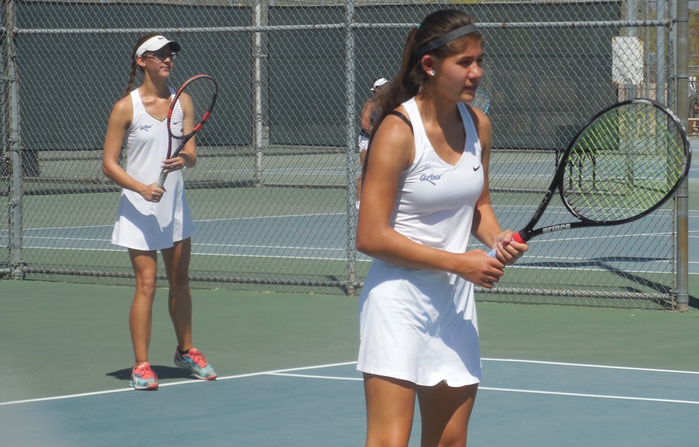 Sophomore Jayme Shafer (background) and freshman Ashley Fitzsimmons (foreground) won the No. 3 doubles consolation bracket after they beat Kelsea Baksh and Katherine Mitchell from Meridian CC 9-8 ((7) in the tiebreaker. Photo by Raymond Suarez