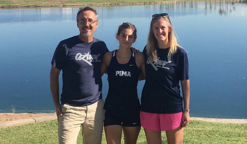 Freshman Katherine Bruno (center) took first place in the ACCAC Conference Championship 5K race with a time of 18 minutes, 37.9 seconds. The women's team took second place. Here with head coach Greg Wenneborg and Assistant Coach Allison Januszewski. Photo courtesy of Greg Wenneborg