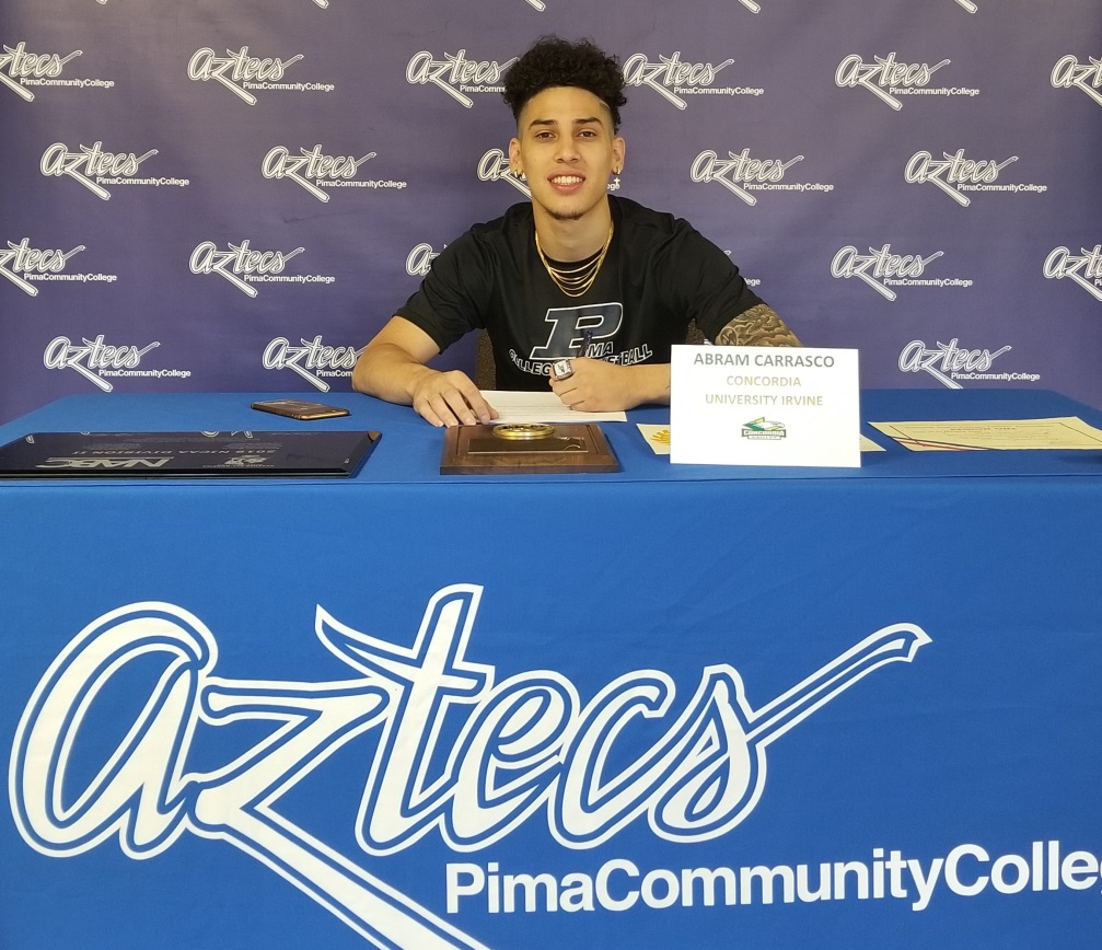 Sophomore guard Abram Carrasco (Cholla HS) signed his letter of intent to play at Concordia University Irvine, an NCAA Division II institution out of the Pacific West Conference in Irvine, CA. Carrasco leaves Pima as the career scoring leader with 1,310 points. He was selected first team NJCAA All-American this season. Photo by Raymond Suarez