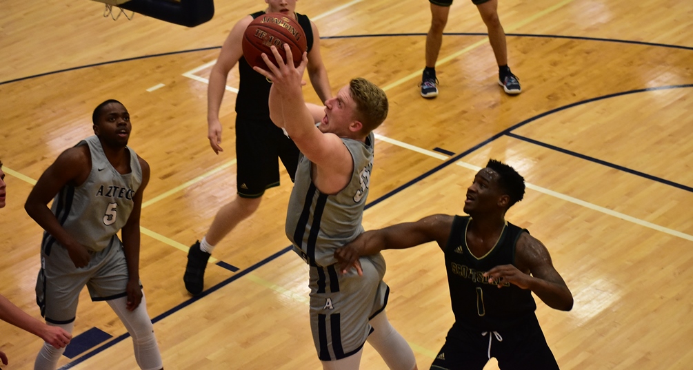 Sophomore Kennedy Koehler posted his 20th double-double of the season as he went 10 for 14 from the field with 26 points and 15 rebounds. The No. 3 seeded Aztecs defeated No. 6 St. Clair County Community College 93-75 in Thursday's consolation game. The Aztecs will play Pitt Community College in another consolation match-up on Friday. Photo by Ben Carbajal