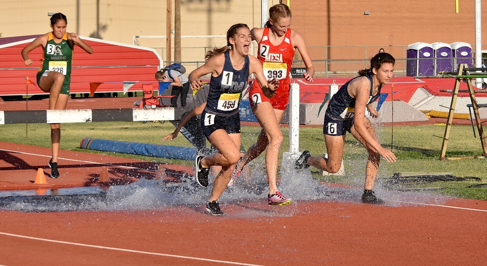 Sophomore Katherine Bruno (left) took sixth place in the women's 3,000 meter steeplechase with a time of 12 minutes, 10.62 seconds. Freshman Mary Siml claimed seventh in the steeplechase with a time of 12:11.14. Both earned team points for the Aztecs on Friday in the second day of the NJCAA Division I National Championships. Photo by Ben Carbajal