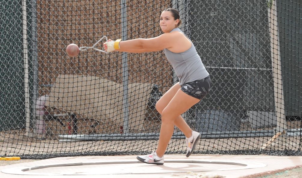 Sophomore Annika Arvayo (Salpointe Catholic HS) earned a national qualifying mark in the Weight Throw as she took first place with a throw of 14.99 meters (49-2.25) on her fifth attempt. Photo by Ray Suarez